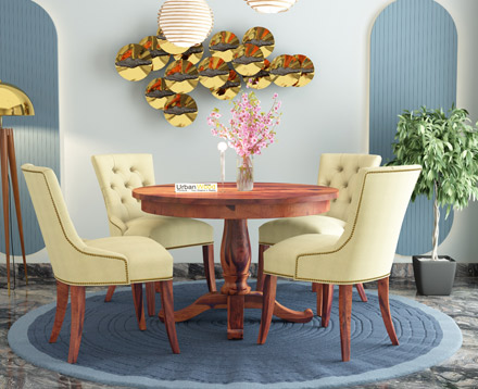 Round dining table with fabric covered chairs